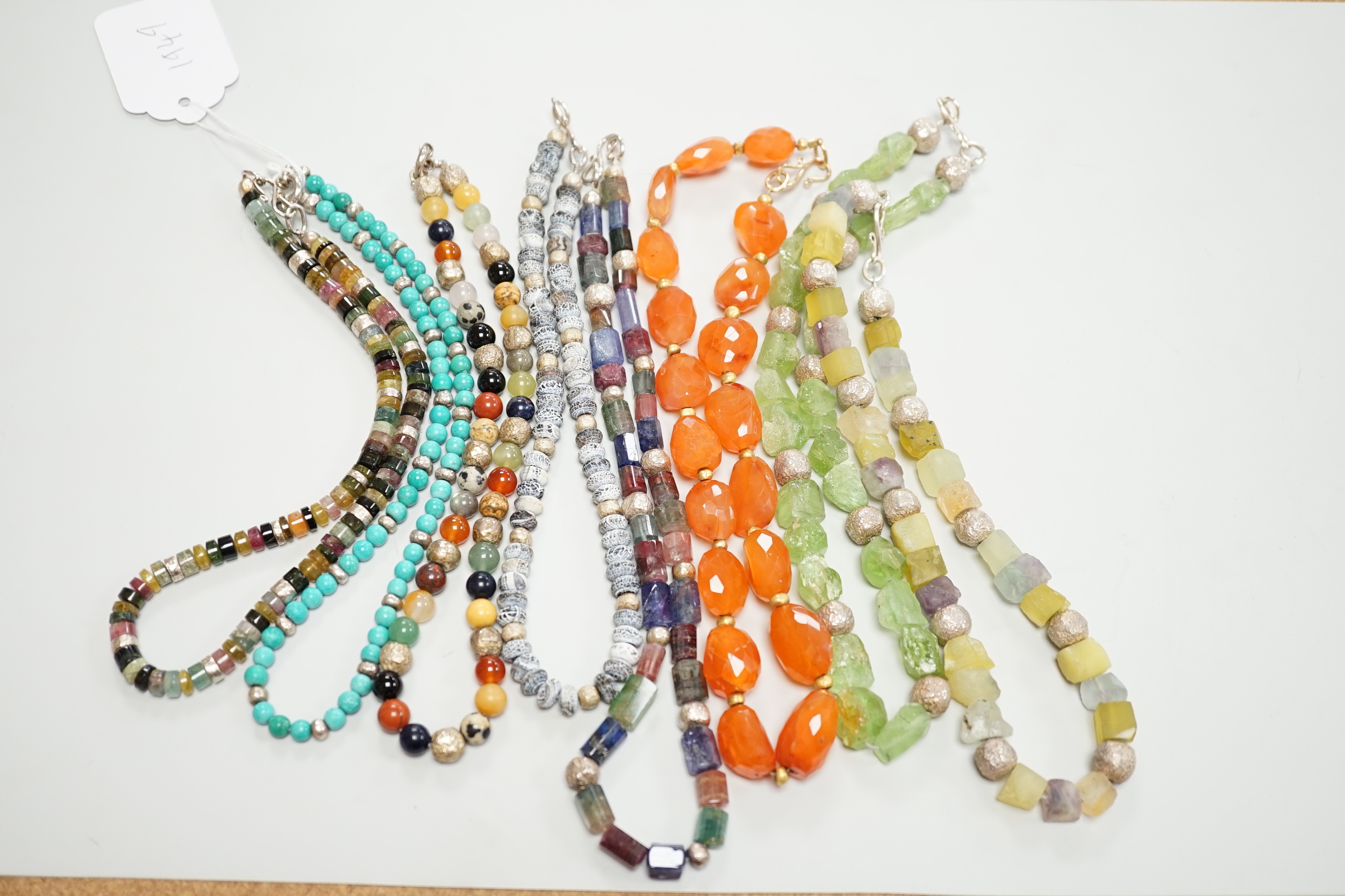 Five assorted Pruden & Smith silver and hardstone necklaces, largest 42cm and three other similar unsigned necklaces.